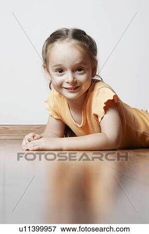 Little Girl Lying on Wood Floor View Large Photo Image Stock Photo - Little Girl Lying on Wood Floor. Fotosearch