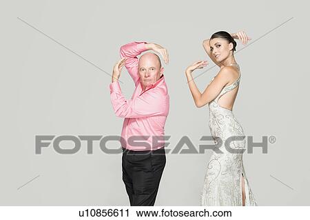 Man and woman striking poses View Large Photo Image Stock Image - Man and woman striking poses. Fotosearch
