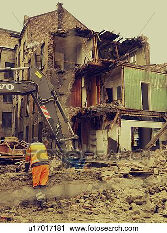 Stock Image - Man at demolition site. Fotosearch