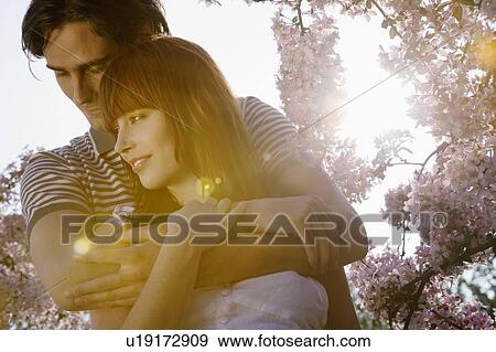 Stock Photo - Man Holding his Girlfriend. Fotosearch
