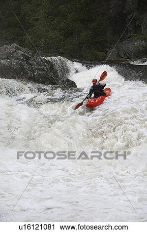 Man kayaking in river View Large Photo Image Stock Image - Man kayaking in river. Fotosearch
