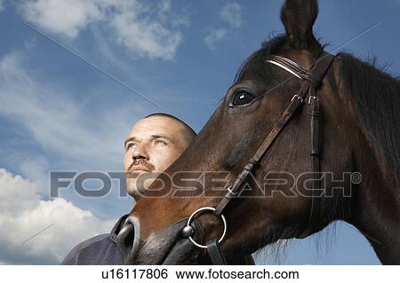 Stock Photograph - Man with Horse. Fotosearch