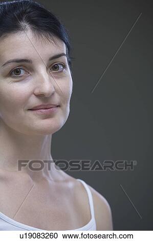 Mid-adult woman looking away, close-up view, studio shot View Large Photo Image Stock Image - Mid-adult woman looking away, close-up view, studio shot. Fotosearch