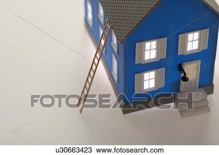 Stock Image - Model house with ladder. Fotosearch