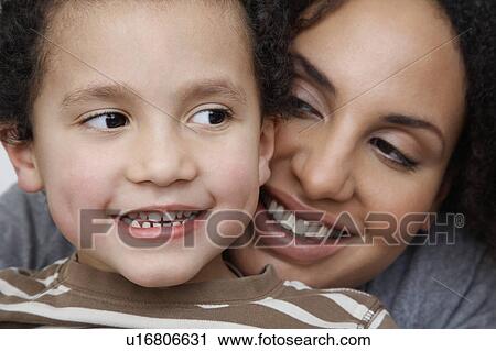 Mother and son (5-6) cheek to cheek, smiling View Large Photo Image Stock Image - Mother and son (5-6) cheek to cheek, smiling. Fotosearch