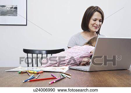 Mother using laptop, being disturbed by daughter (3-4) View Large Photo Image Stock Image - Mother using laptop, being disturbed by daughter (3-4). Fotosearch