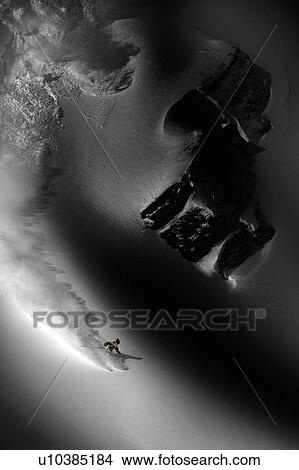 Picture - Night skiier on Murren in the French Alps. Fotosearch