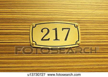 Stock Photo - Number plate on wood grain. Fotosearch