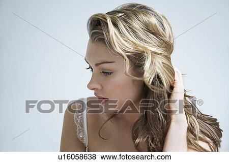 Stock Photo - Pensive young woman, close-up. Fotosearch
