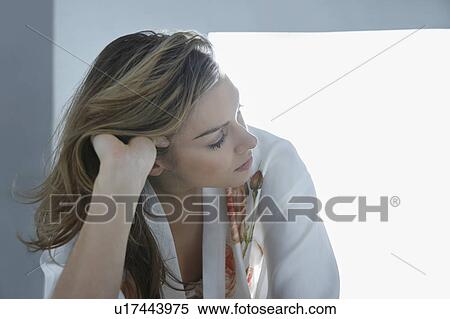 Pensive young woman in dressing gown View Large Photo Image Stock Photography - Pensive young woman in dressing gown. Fotosearch
