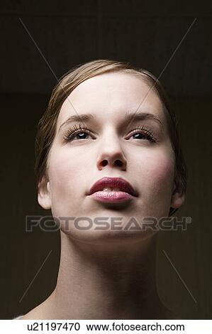 Stock Image - Pensive young woman, portrait. Fotosearch
