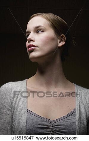 Stock Photo - Pensive young woman, portrait. Fotosearch