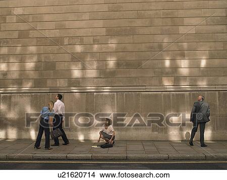 People on sidewalk, looking up View Large Photo Image Picture - People on sidewalk, looking up. Fotosearch