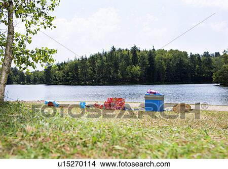 Picnic gear on lakeshore View Large Photo Image Picture - Picnic gear on lakeshore. Fotosearch