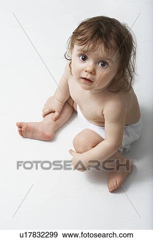 Portrait of girl (1-2) looking up, studio shot View Large Photo Image Stock Photo - Portrait of girl (1-2) looking up, studio shot. Fotosearch