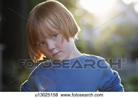 Stock Photo - Portrait of girl (5-6) outdoors. Fotosearch