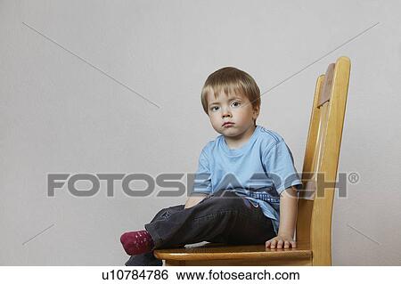 Stock Photograph - Portrait of Little Boy in Blue Shirt. Fotosearch
