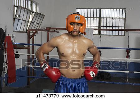 Stock Photo - Portrait of man in boxing ring. Fotosearch