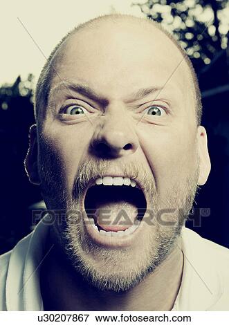 Portrait of mid-adult man screaming View Large Photo Image Stock Photo - Portrait of mid-adult man screaming. Fotosearch