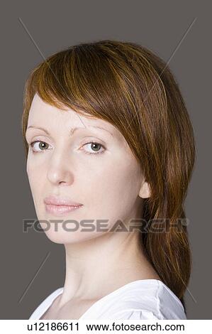 Portrait of mid adult woman, studio shot View Large Photo Image Stock Image - Portrait of mid adult woman, studio shot. Fotosearch