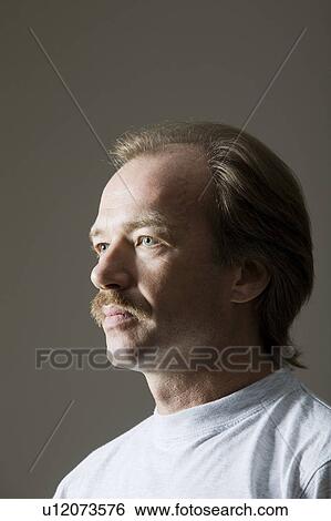 Portrait Of Middle-Aged Man With Moustache, Studio Shot View Large Photo Image Stock Photograph - Portrait Of Middle-Aged Man With Moustache, Studio Shot. Fotosearch