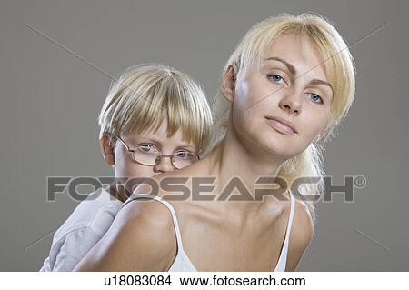 Portrait Of Mother And Son, Studio Shot View Large Photo Image Picture - Portrait Of Mother And Son, Studio Shot. Fotosearch