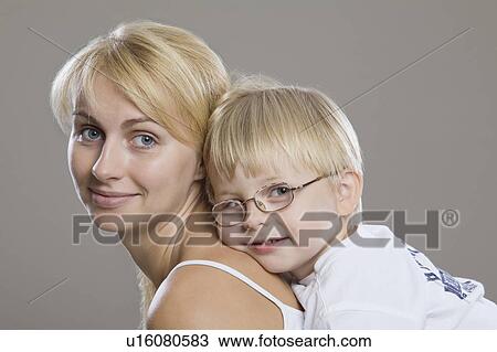 Stock Image - Portrait Of Mother And Son, Studio Shot. Fotosearch