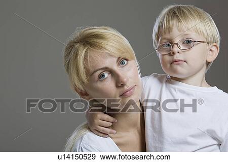 Stock Photo - Portrait Of Mother And Son, Studio Shot. Fotosearch