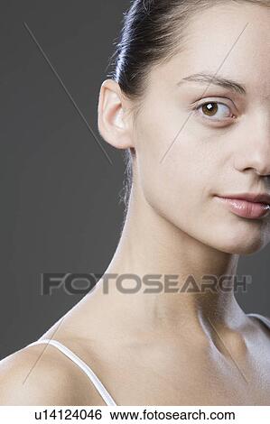 Portrait Of Young Woman Looking Away, Studio Shot View Large Photo Image Stock Photograph - Portrait Of Young Woman Looking Away, Studio Shot. Fotosearch