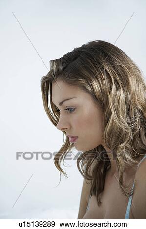 Stock Photo - Profile of young woman. Fotosearch