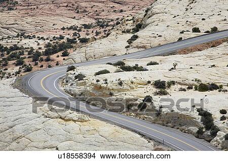 Picture - Road through barren desert, elevated view. Fotosearch