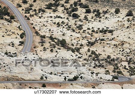 Road through barren desert, elevated view View Large Photo Image Stock Photo - Road through barren desert, elevated view. Fotosearch