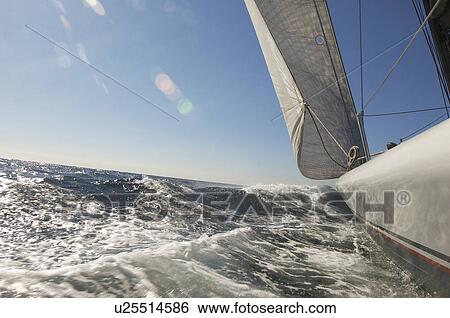 Stock Photograph - Sailboat on ocean. Fotosearch