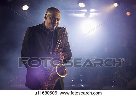 Saxophone player on stage, portrait View Large Photo Image Stock Photograph - Saxophone player on stage, portrait. Fotosearch