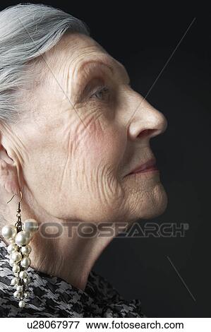Senior Woman with Pearl Earrings View Large Photo Image Stock Photo - Senior Woman with Pearl Earrings. Fotosearch
