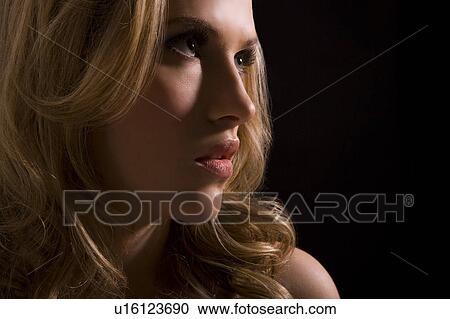 Stock Image - Sexy young woman, pensive. Fotosearch