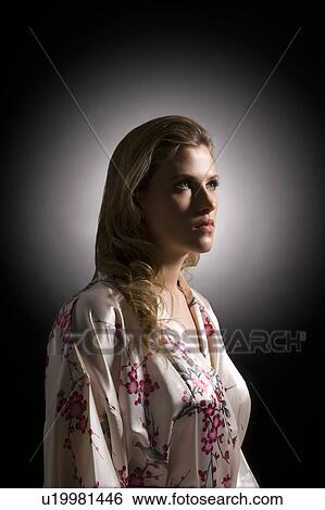 Stock Photograph - Sexy young woman wearing silk bathrobe. Fotosearch