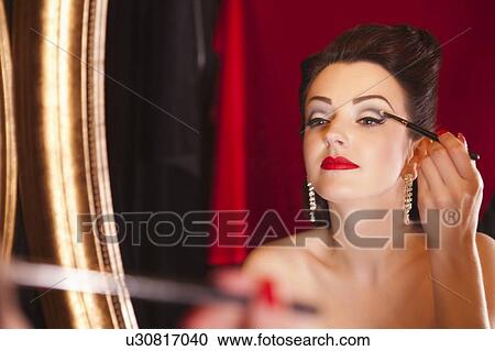Showgirl applying eye shadow View Large Photo Image Stock Image - Showgirl applying eye shadow. Fotosearch