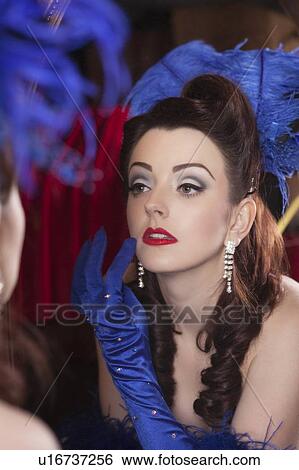 Showgirl checking herself in mirror View Large Photo Image Stock Photograph - Showgirl checking herself in mirror. Fotosearch