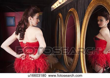 Showgirl tightening corset View Large Photo Image Stock Image - Showgirl tightening corset. Fotosearch