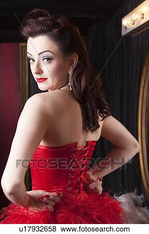Showgirl tightening corset View Large Photo Image Stock Photo - Showgirl tightening corset. Fotosearch