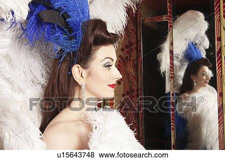 Stock Photo - Showgirl with reflection in mirror. Fotosearch