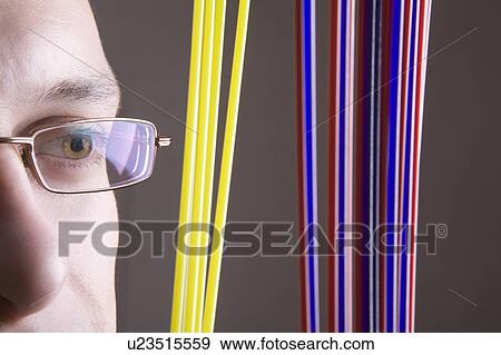 Stock Photo - Specialist examines craft product. Fotosearch