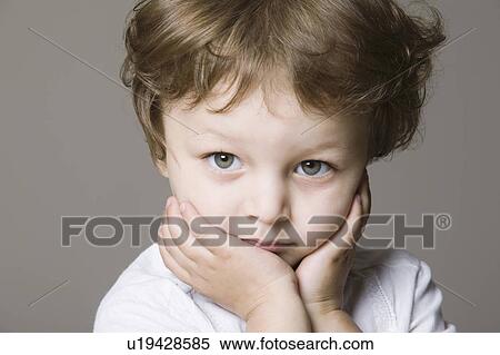 Studio portrait of boy, close-up View Large Photo Image Stock Photography - Studio portrait of boy, close-up. Fotosearch