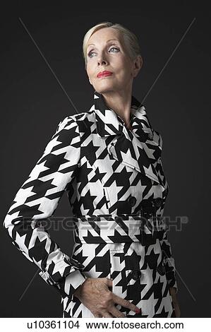 Stylish Senior Woman in black and white coat View Large Photo Image Picture - Stylish Senior Woman in black and white coat. Fotosearch