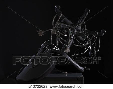 Stock Photo - Tangled computer cables and office chair . Fotosearch