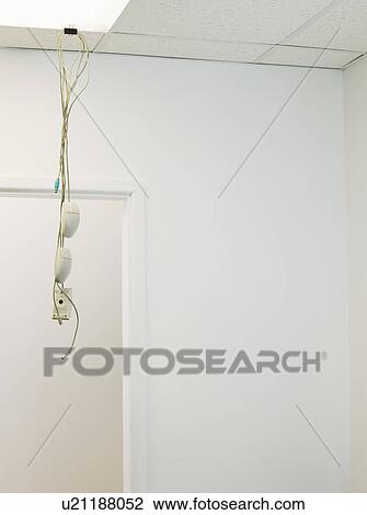 Stock Image - Tangled Hanging from Office Ceiling. Fotosearch