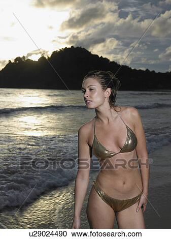 Stock Image - Thailand, young woman in bikini on beach. Fotosearch