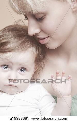 Toddler looks non-plussed at camera View Large Photo Image Stock Image - Toddler looks non-plussed at camera. Fotosearch