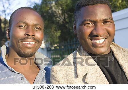 Two friends in their late 30s View Large Photo Image Stock Image - Two friends in their late 30s. Fotosearch